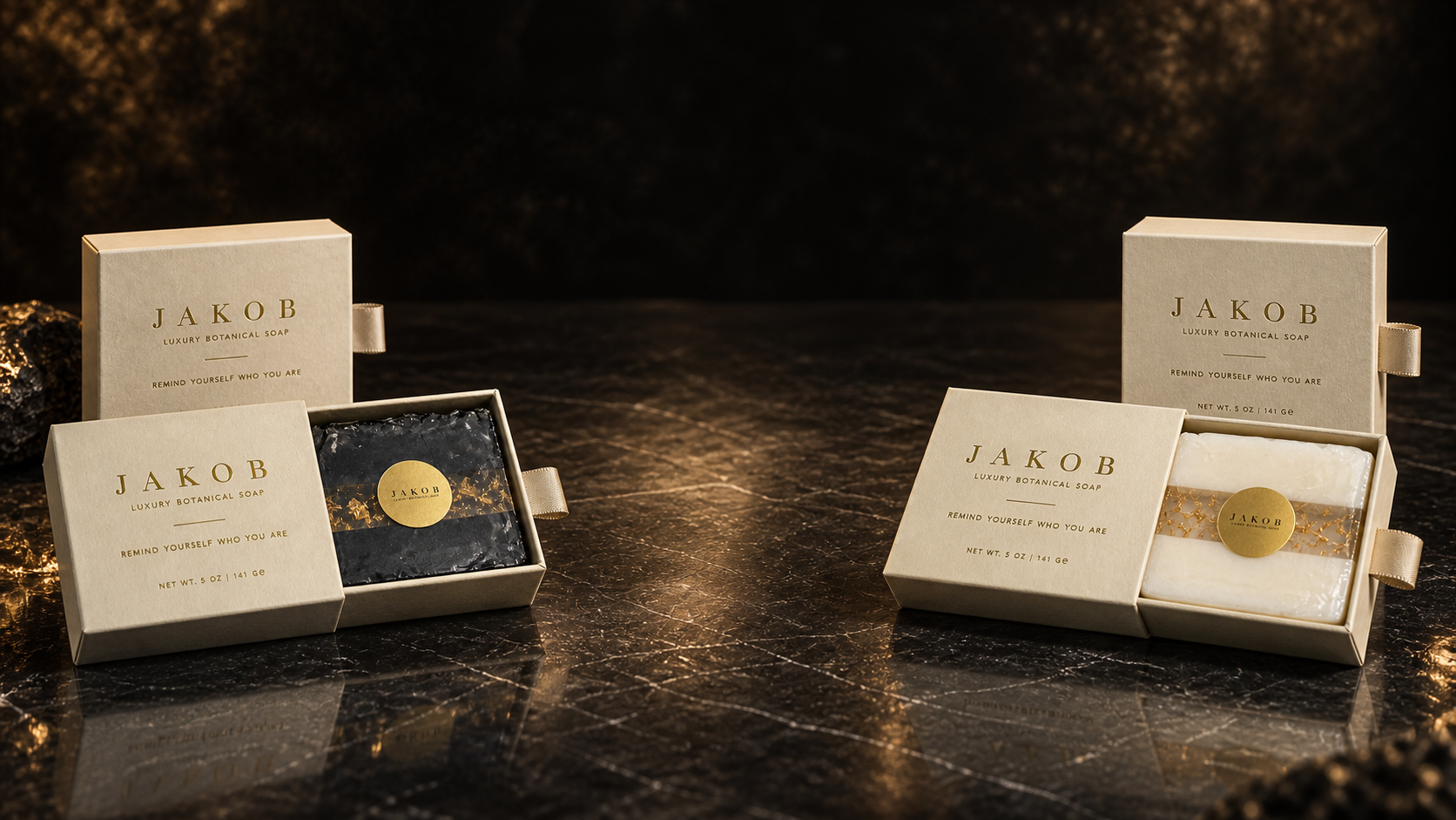 JAKOB Obsidian Gold and Ivory Reserve soaps with their presentation boxes